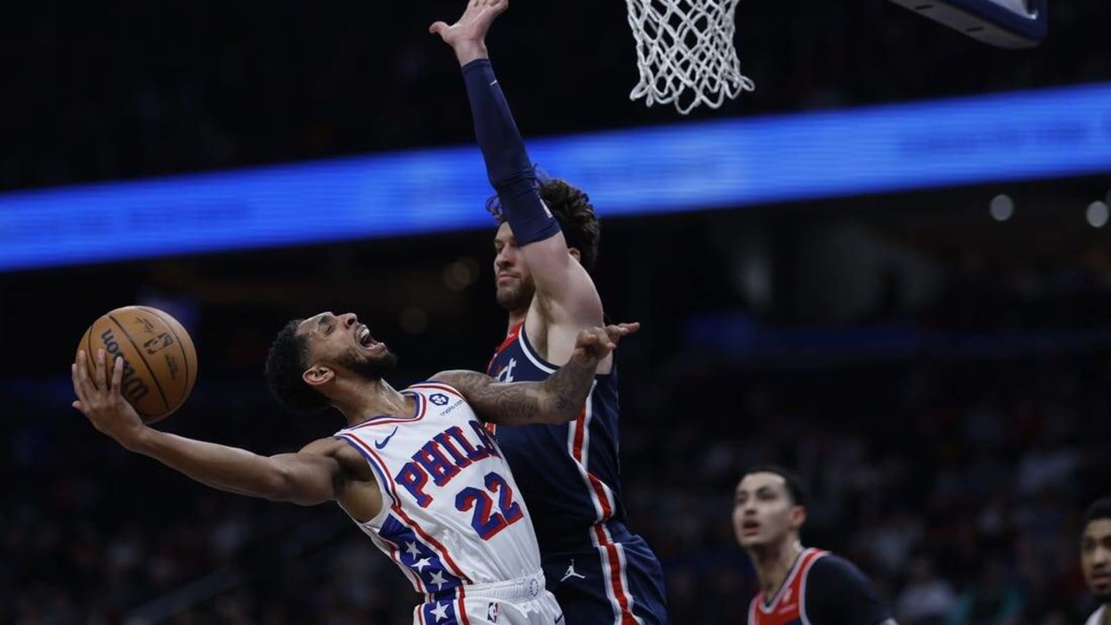 Undermanned 76ers fend off Wizards, snap skid