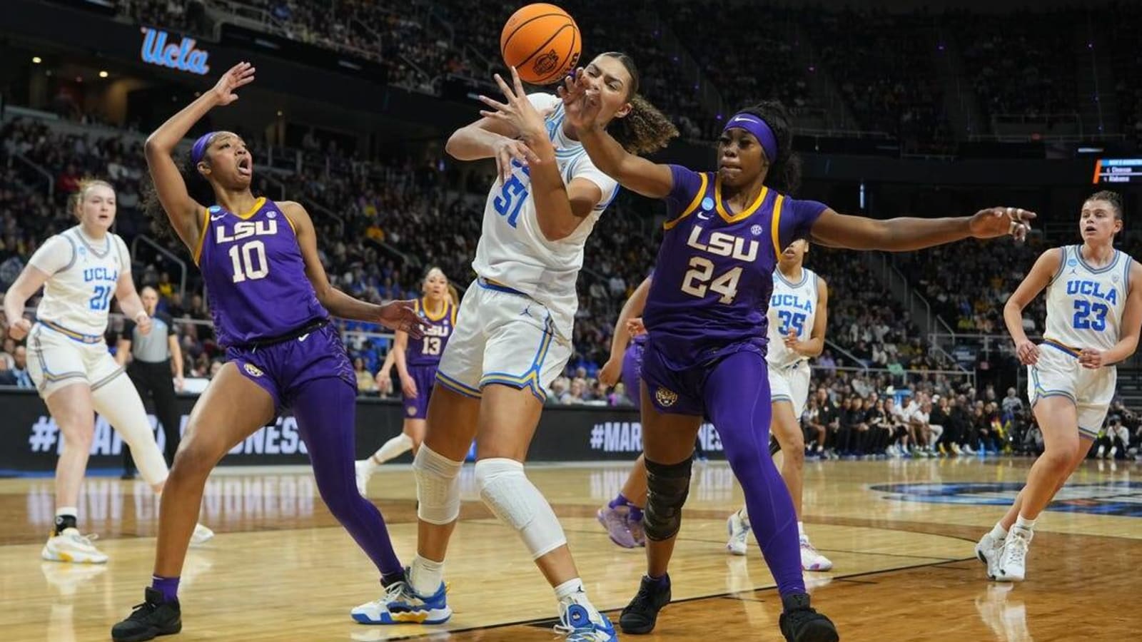 Defending champ LSU rallies late, turns back UCLA