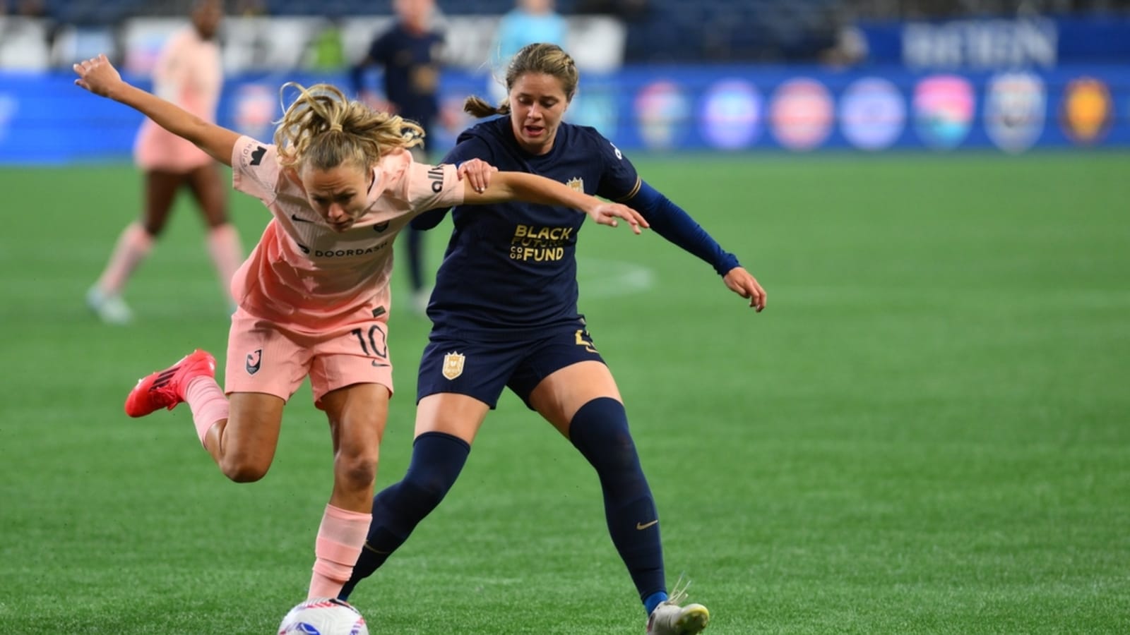 Reign D Shae Holmes signs through 2026 season