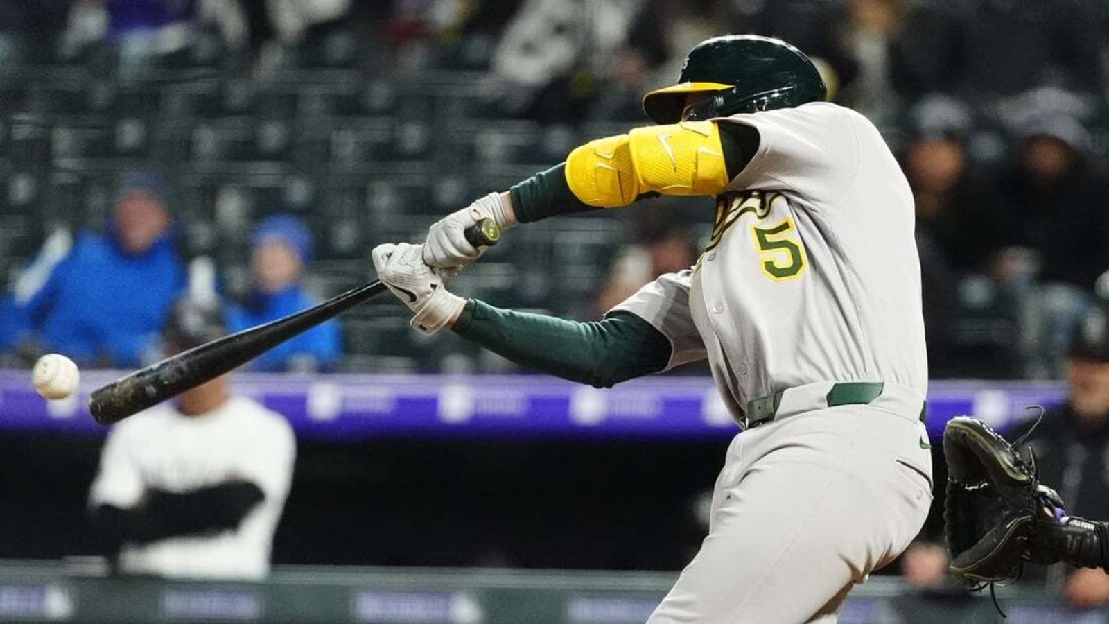 Athletics ride 3-run seventh to rally past Rockies