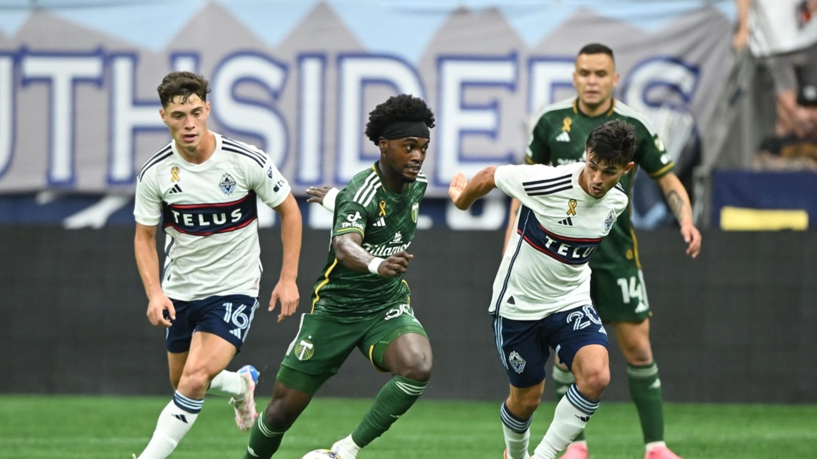 Whitecaps earn draw vs. Timbers to notch playoff berth