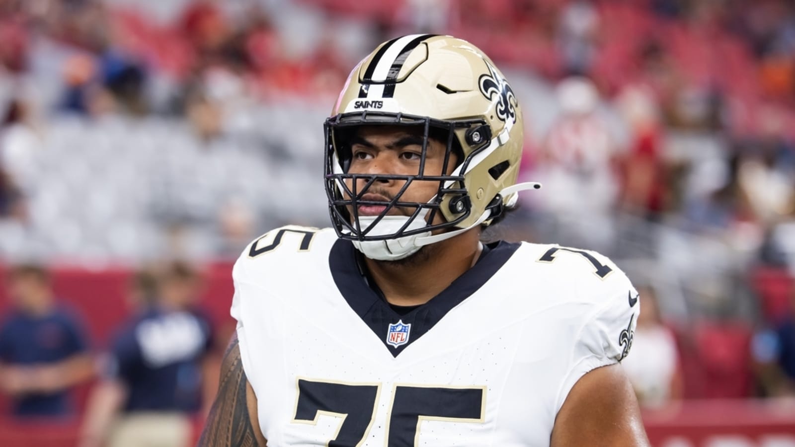 Saints OT Taliese Fuaga (back) misses practice