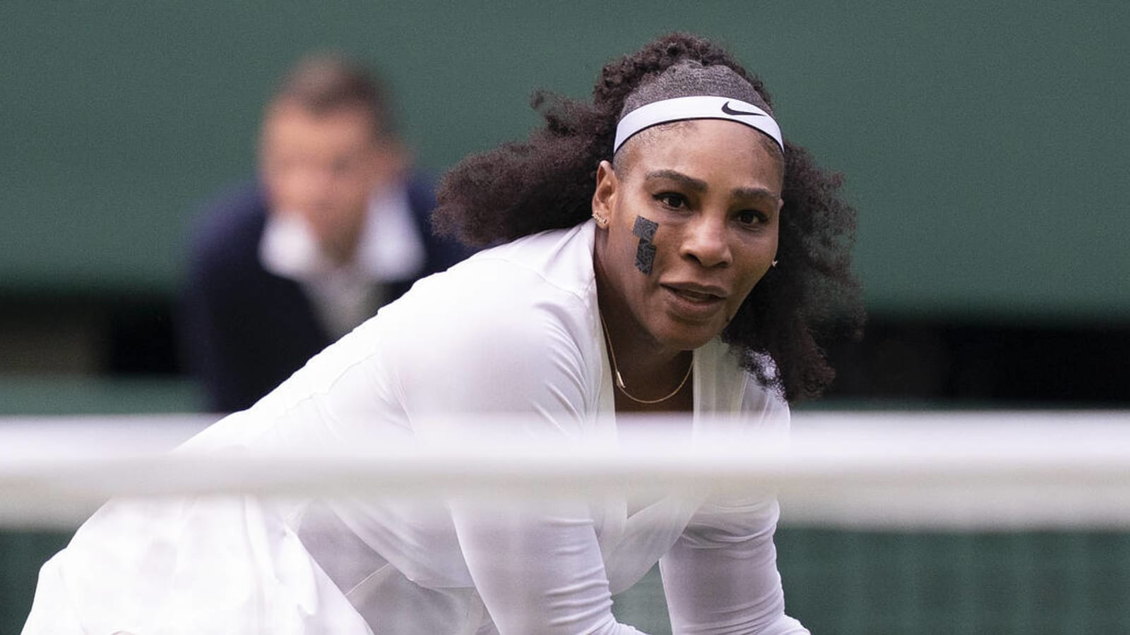Serena Williams wears tape on her face during Wimbledon loss
