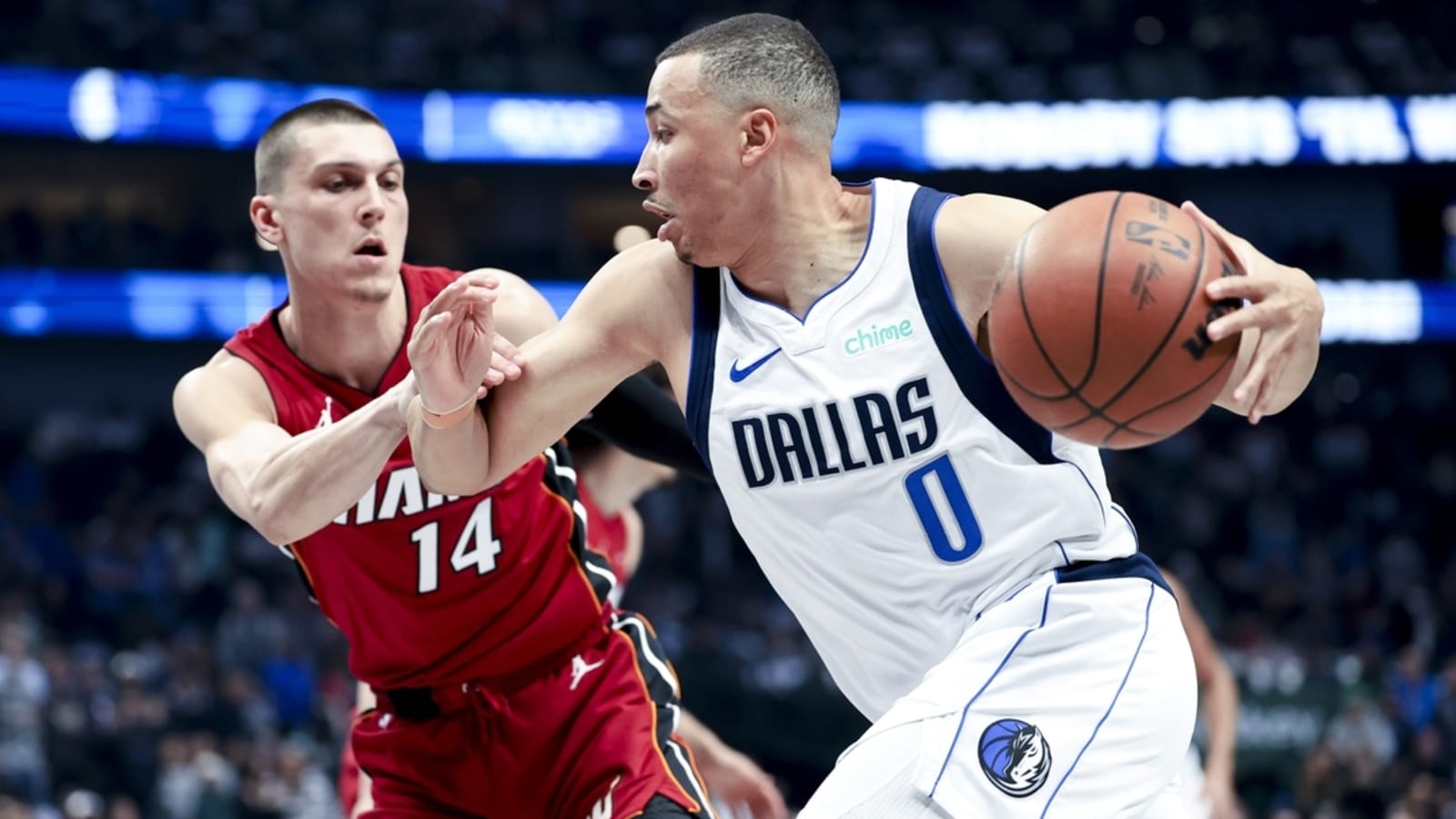 Short-handed Mavericks hold on to beat Heat
