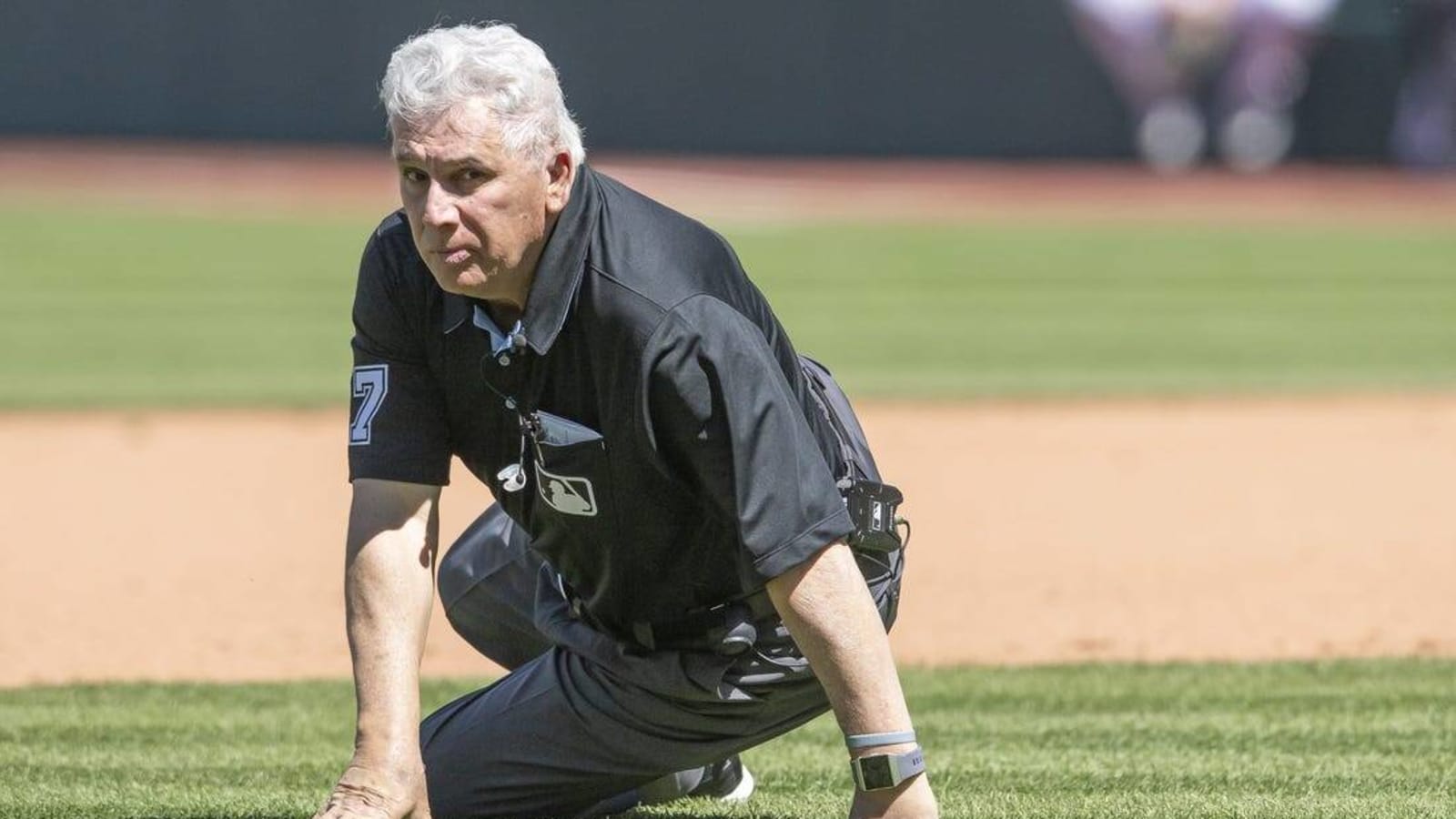 Ump Larry Vanover hit in head by throw, leaves game
