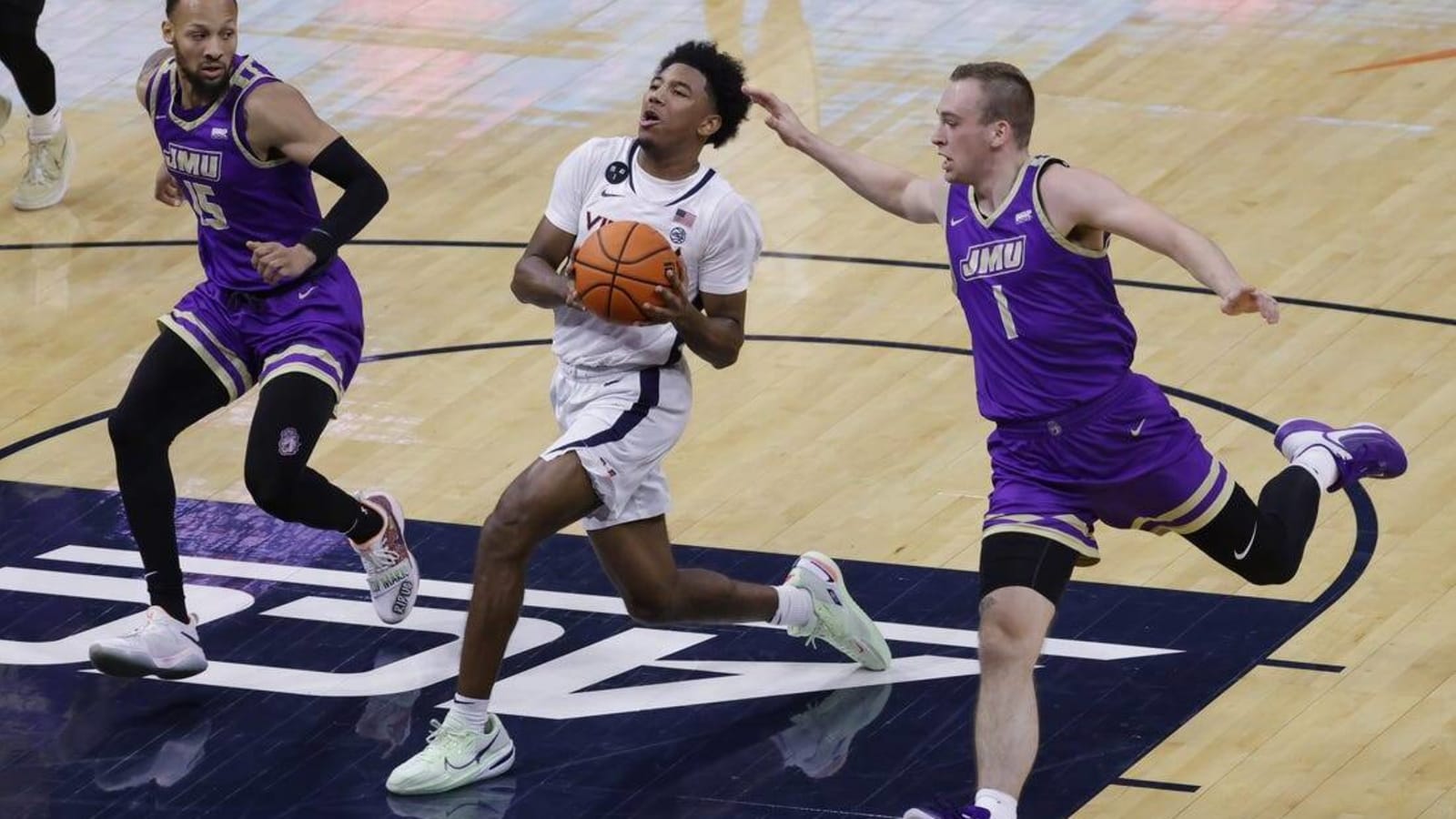 Kihei Clark helps No. 3 Virginia squeak past James Madison