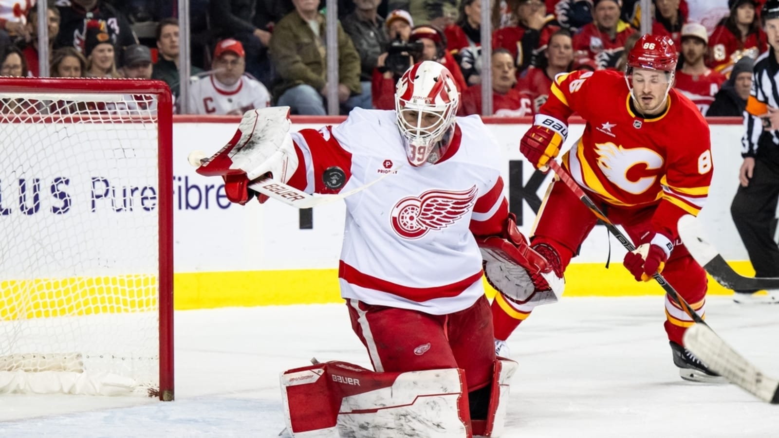 Wings handle Flames in clash of wild-card contenders