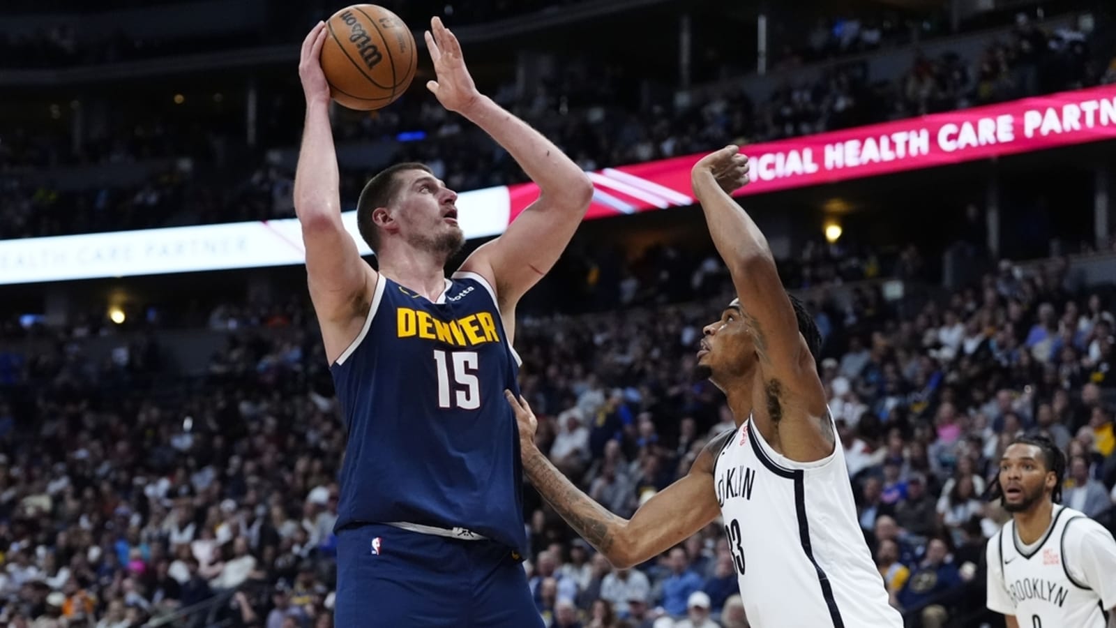 Nuggets get two triple-doubles, thrash Nets