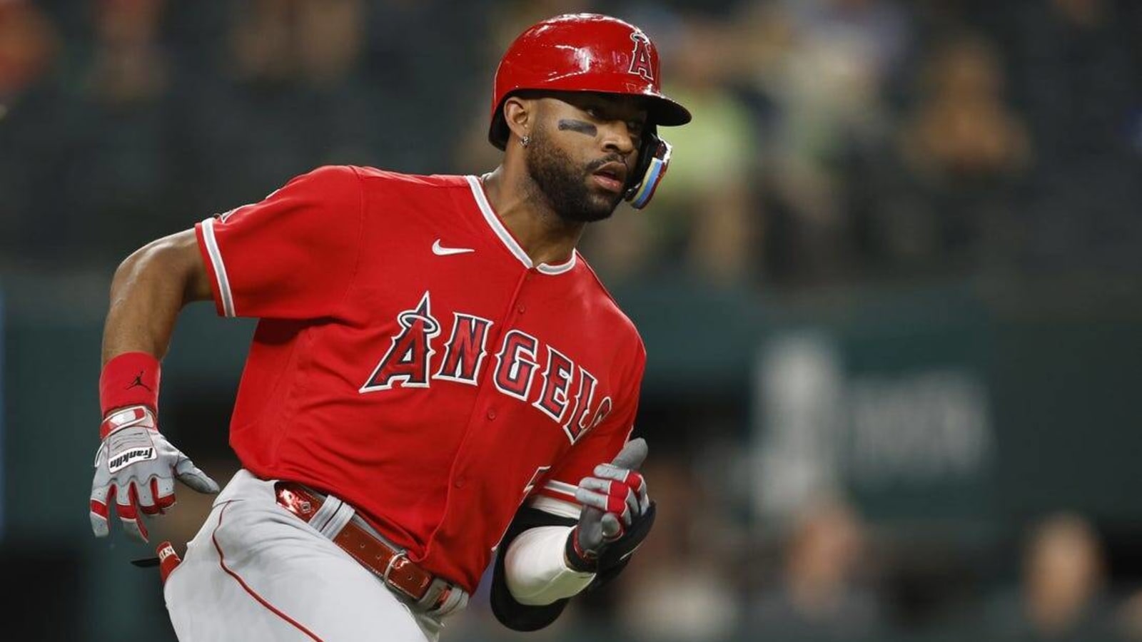 Rangers turn triple play, but Angels emerge with win