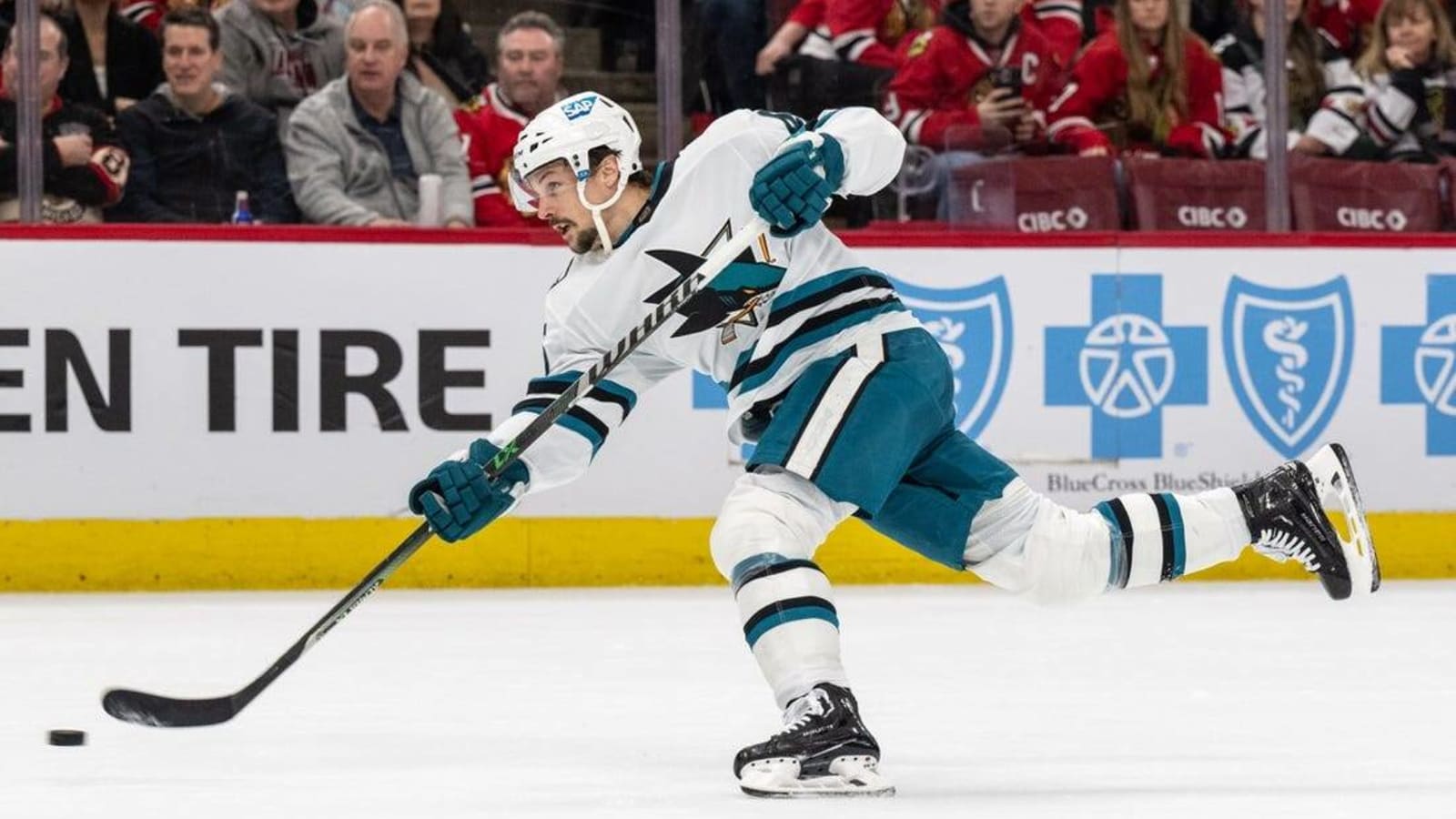 Sharks use late flurry of goals to beat pitiful Blackhawks