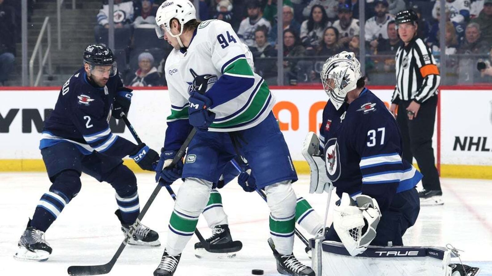 Connor Hellebuyck powers Jets past Canucks for third straight win