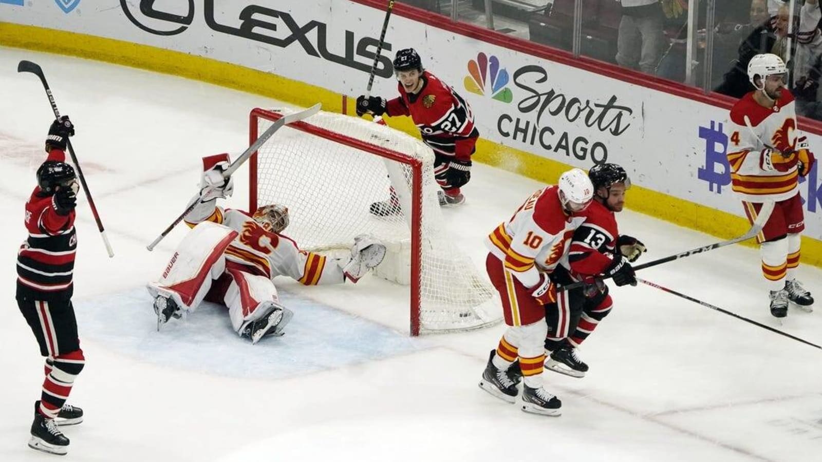 Max Domi scores in OT, Blackhawks topple Flames