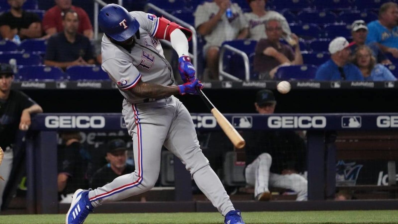 Rangers squeak by Marlins to open doubleheader