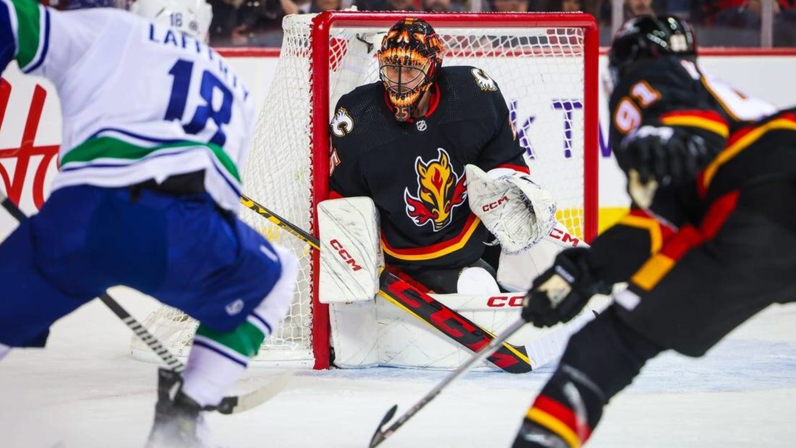 Elias Lindholm logs three points as Flames best Canucks