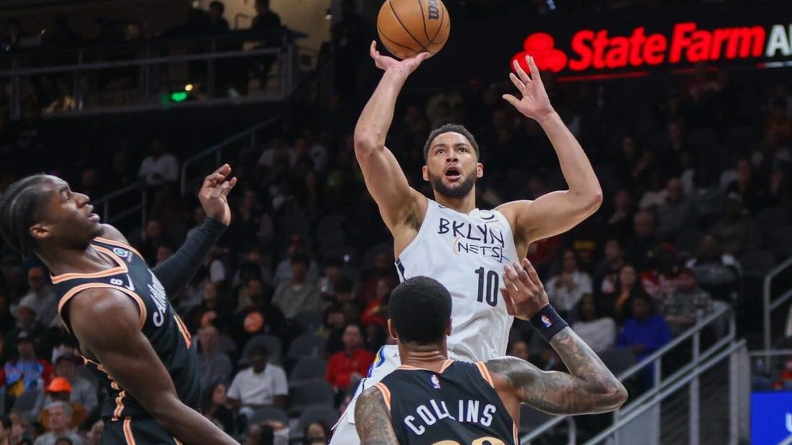 Nets survive late surge to clip Hawks, win 10th straight
