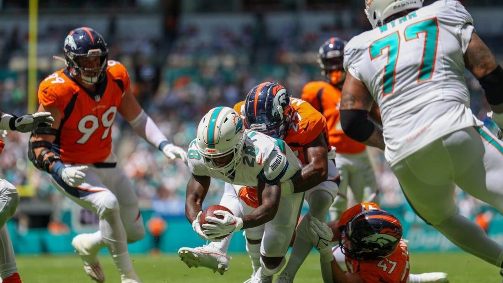 Dolphins pour it on with 70-20 rout over Broncos