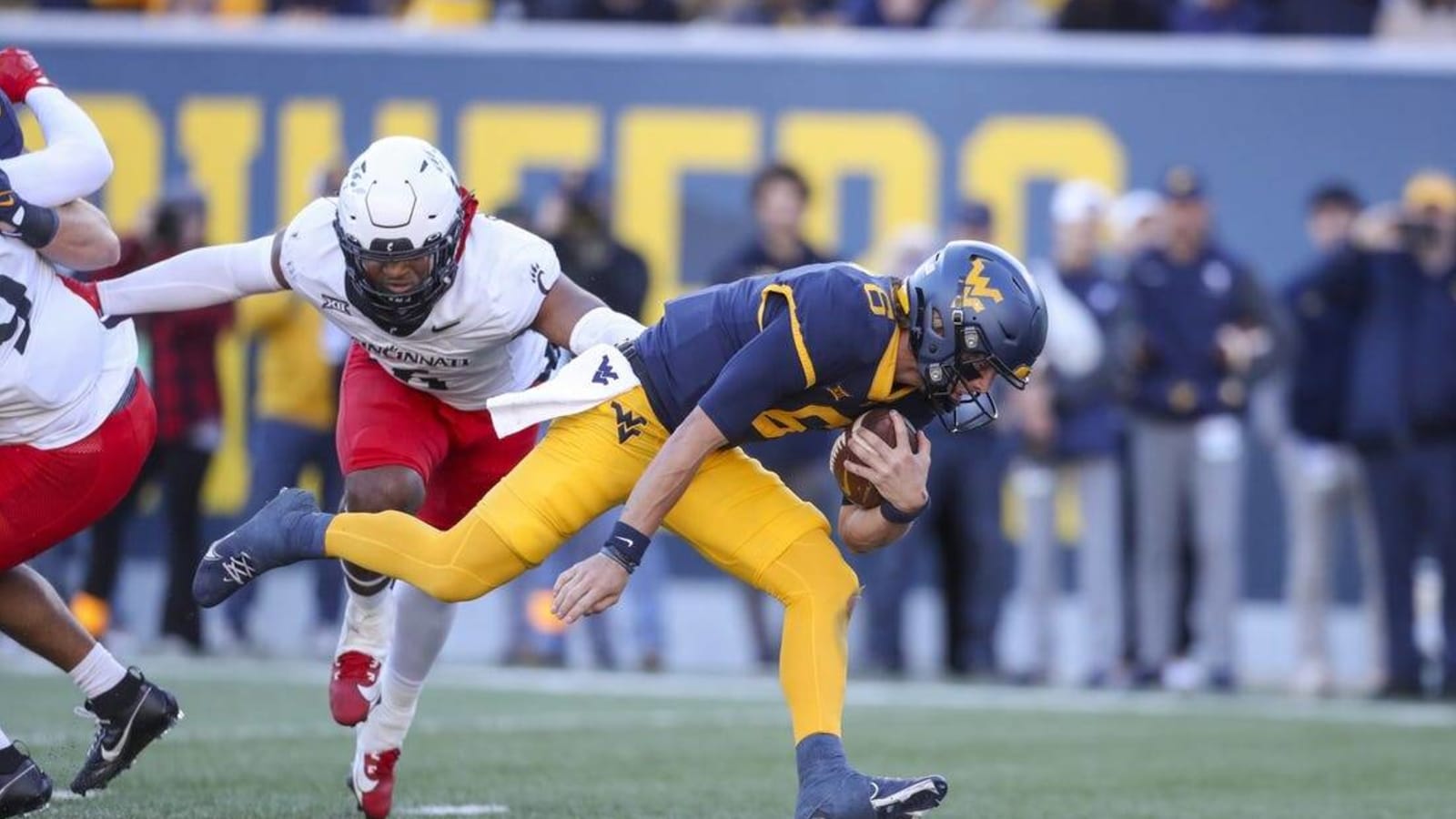 West Virginia rushes for 424 yards in rout of Cincinnati