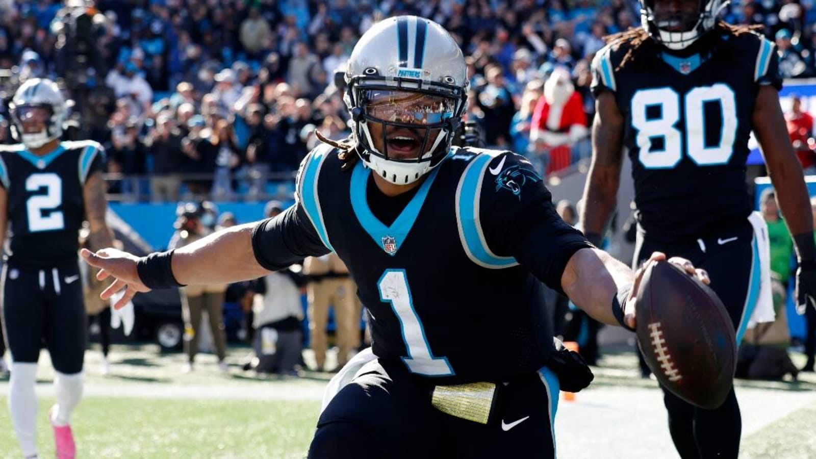 Cam Newton plays catch with kids outside his hotel