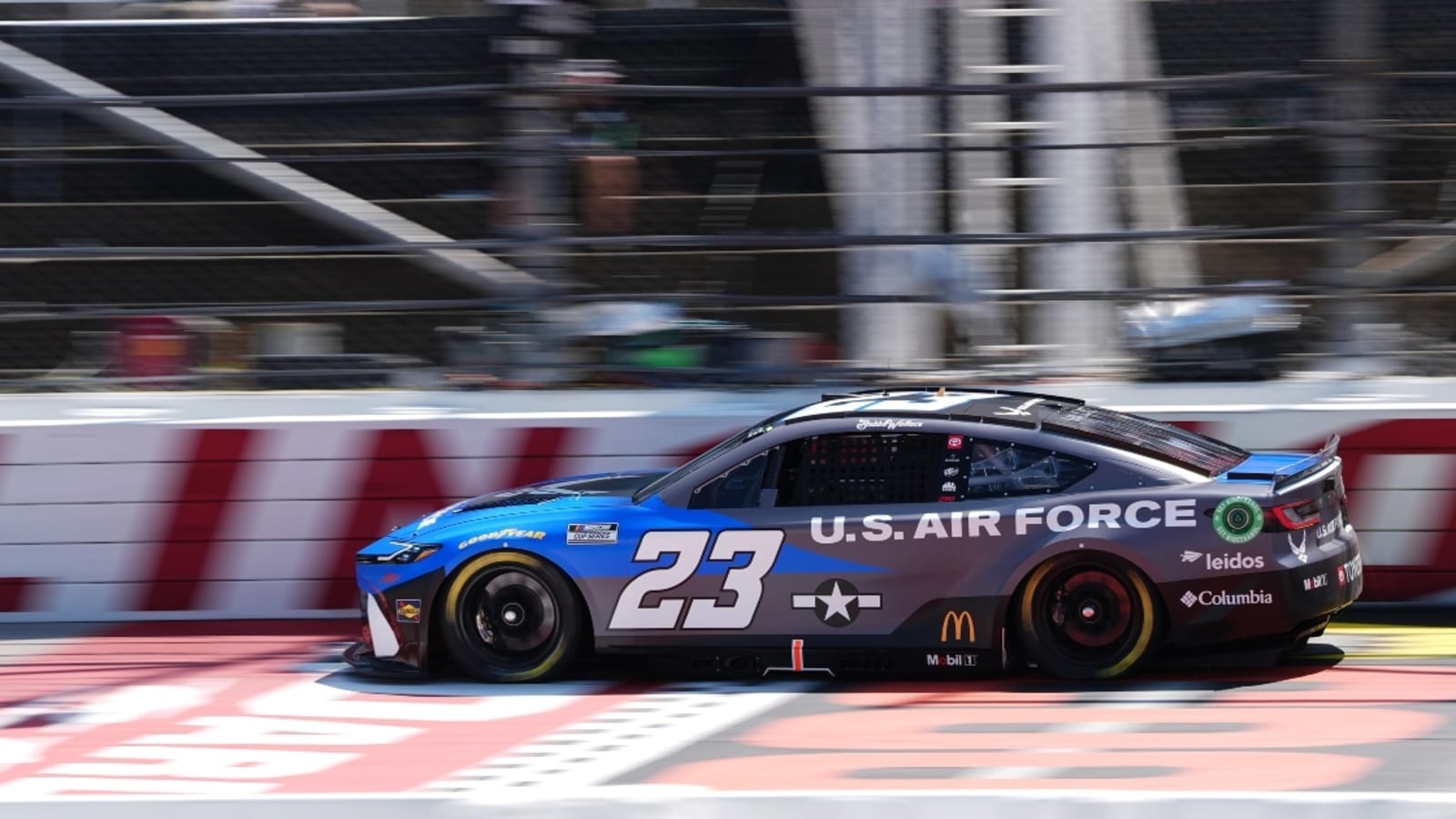 23XI Racing’s Curtis Polk wears hilarious sign at Darlington after receiving new charter offer from NASCAR