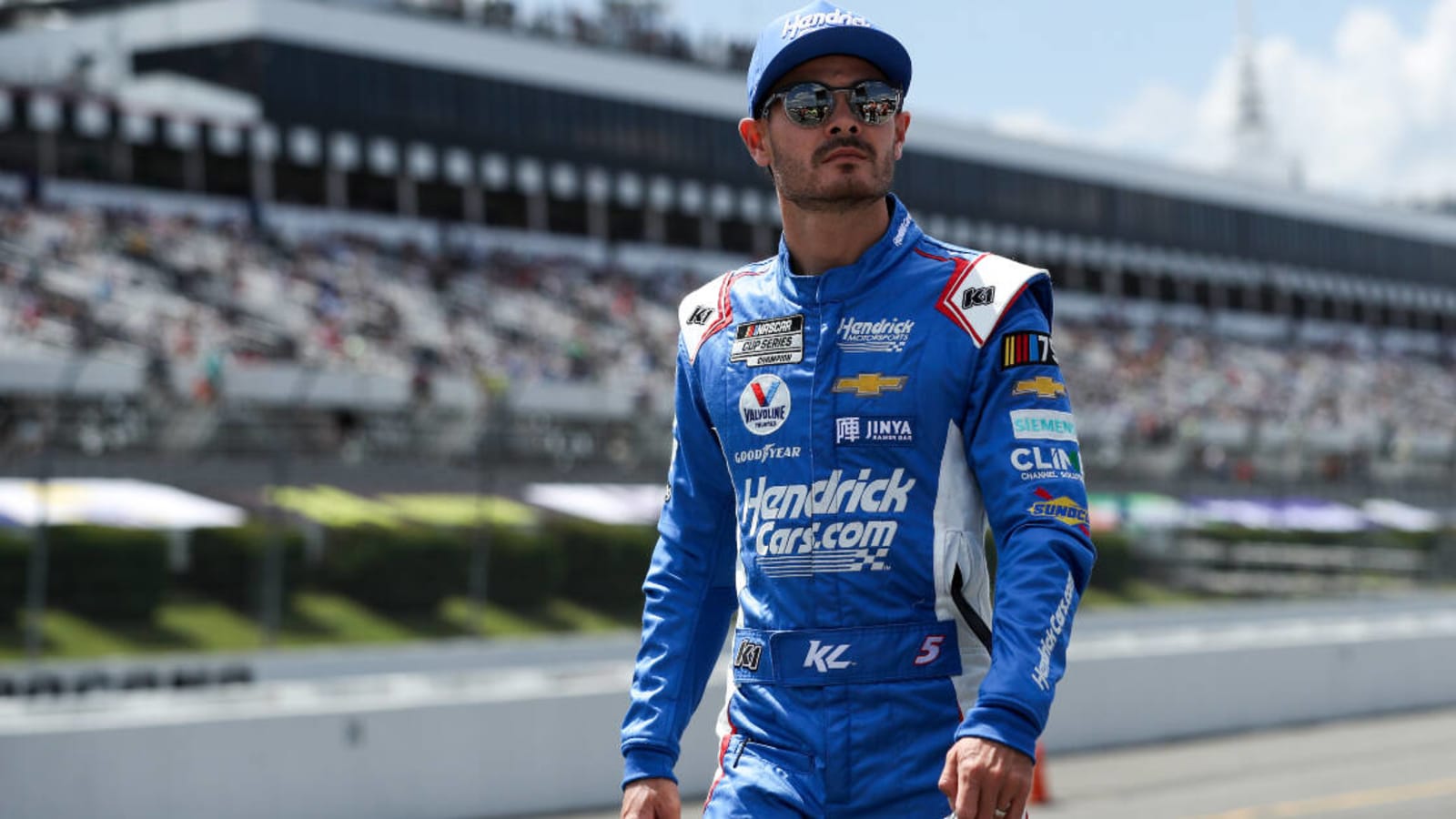 Kyle Larson passes two cars to hit Denny Hamlin under caution