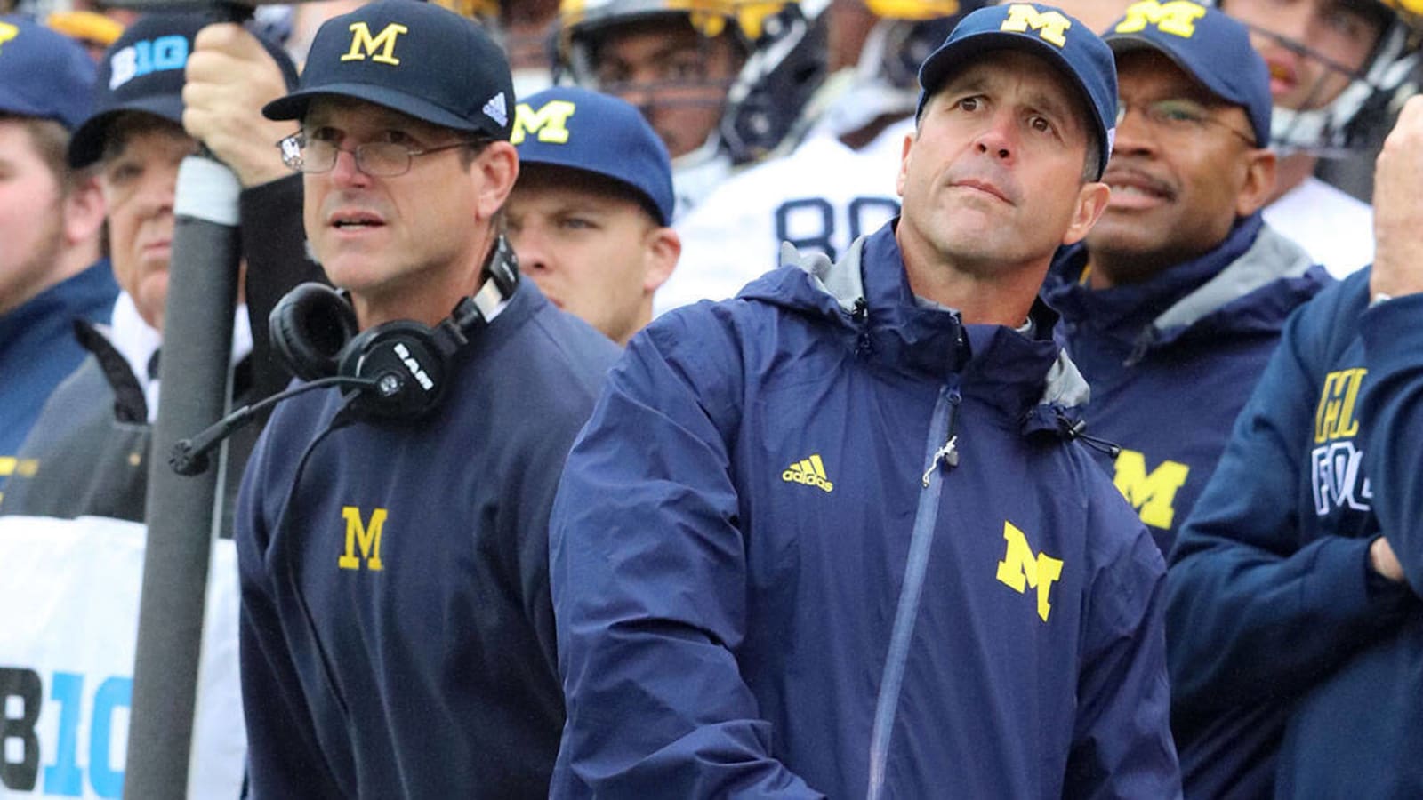 Jim Harbaugh returns the favor, embraces with brother John before