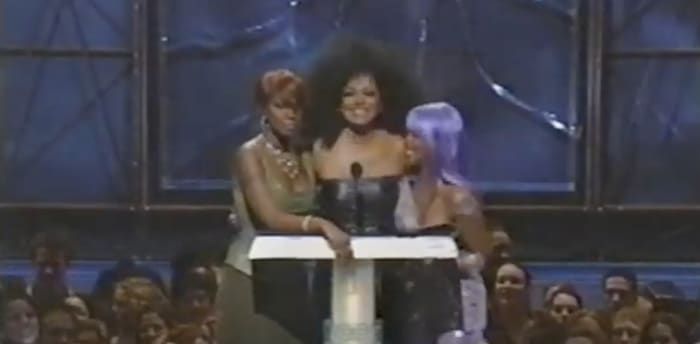 Diana Ross touching Lil’ Kim’s breast
