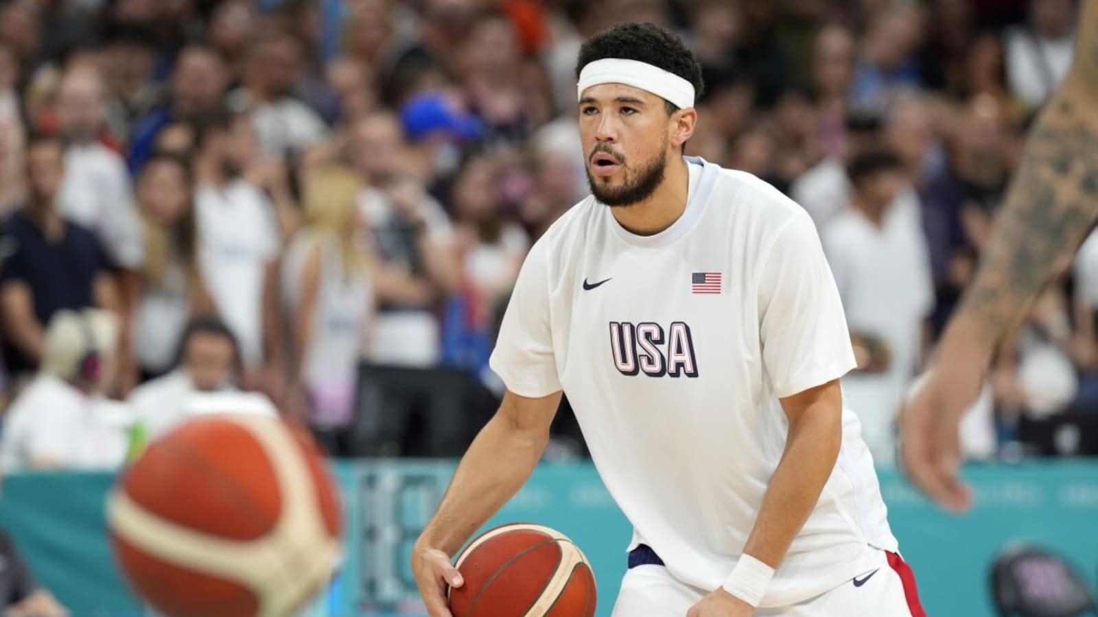 Devin Booker Gifts A Fan His Shoes After Seeing Him Wear His Jersey In Paris