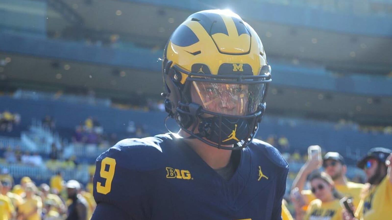 Michigan QB wears shirt in support of suspended coach Yardbarker