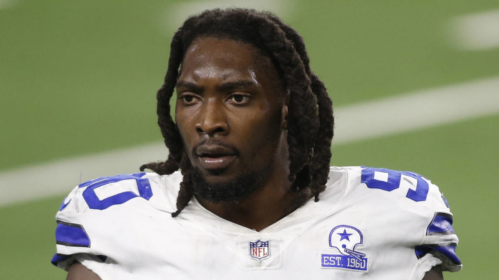 DeMarcus Lawrence responds after getting hit by trash from Cowboys fans