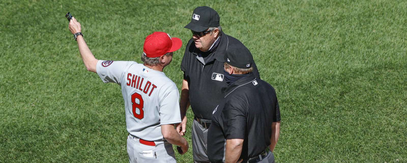 Cardinals reliever Gallegos gets wiped down by umpire after using rosin bag  on his left arm