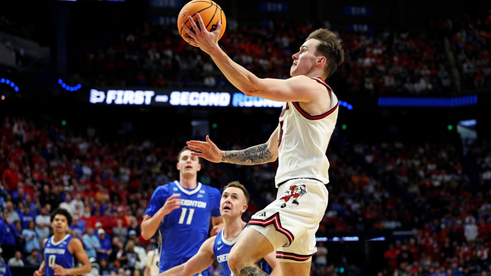 Louisville basketball’s Reyne Smith helped off court in NCAA Tournament opener
