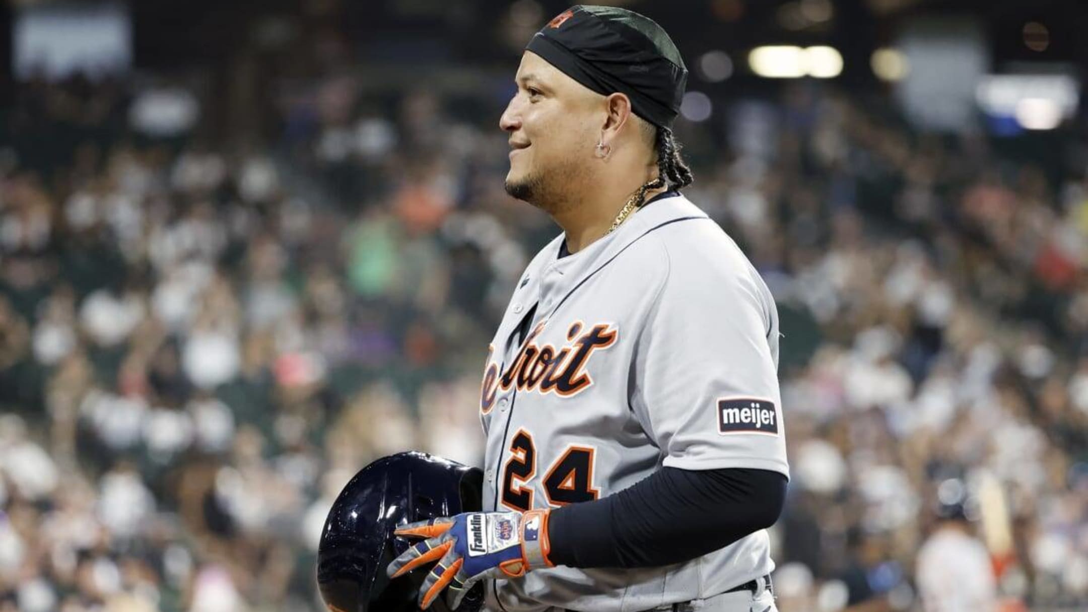 Miguel Cabrera of the Detroit Tigers talks with George Brett a