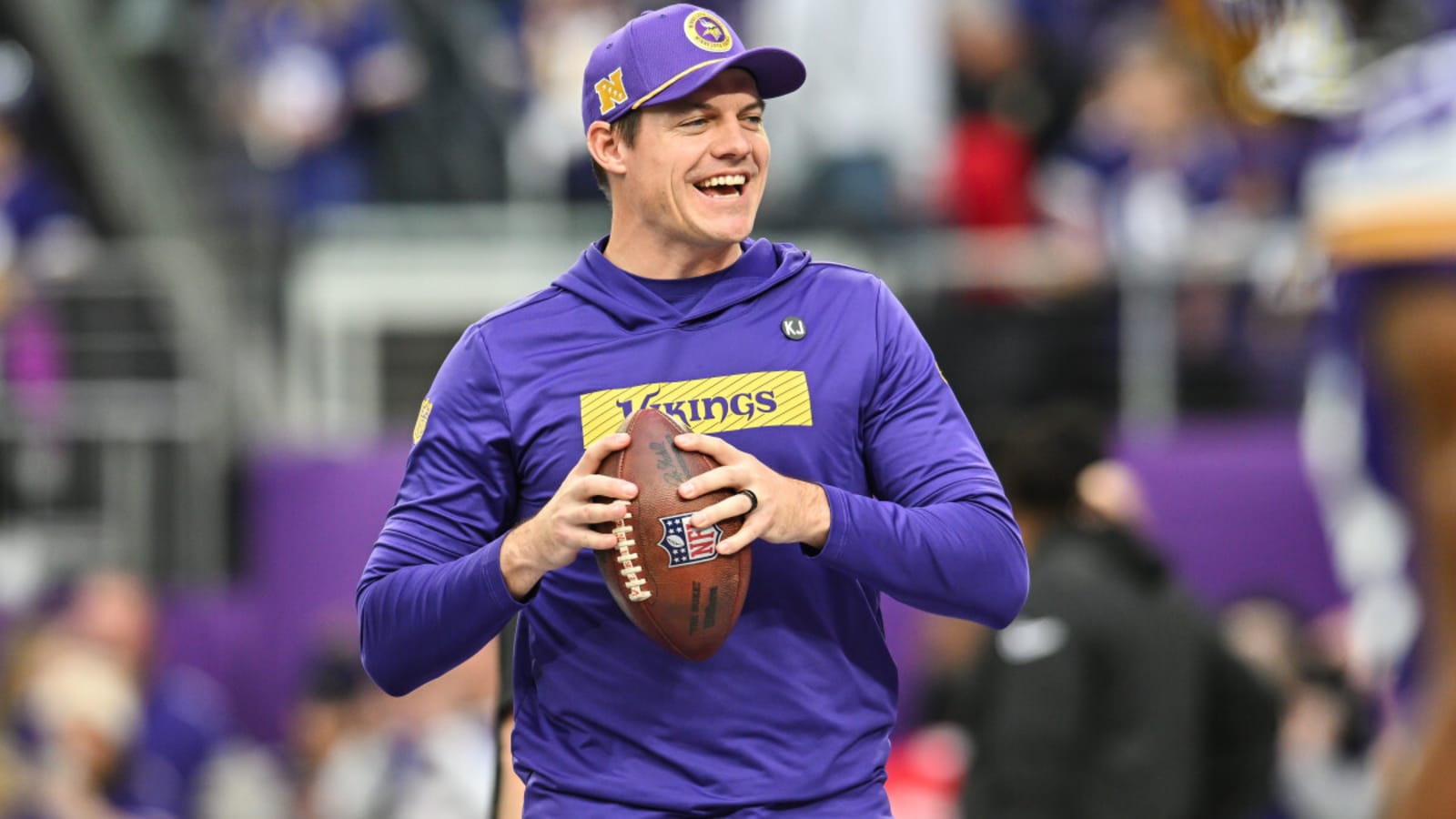 Minnesota Vikings head coach Kevin O'Conell celebrates contract extension with the first of many awards