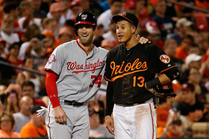Bryce Harper and Manny Machado cash in