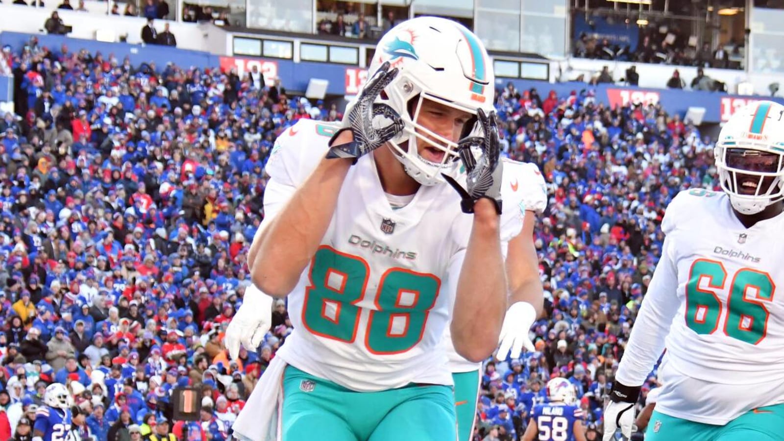 Miami Dolphins tight end Mike Gesicki (88) deflects the ball as