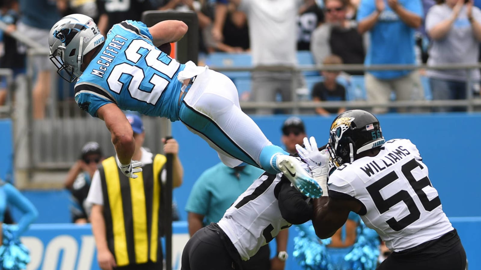 Watch: Christian McCaffrey takes flying leap over defender, flips into end zone for TD