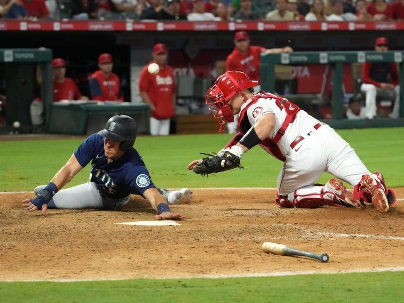 Mariners rally for 4 runs in bizarre 9th inning, beat Angels