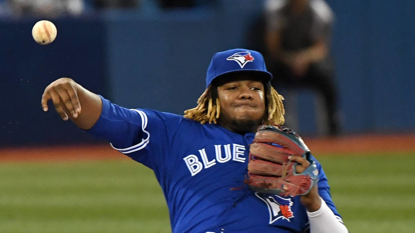 Vladimir Guerrero Jr. throws out runner while sitting down