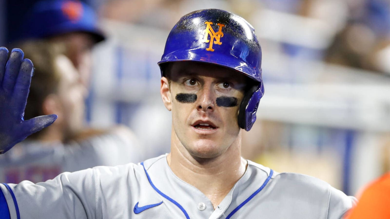 New York Mets left fielder Mark Canha warms up as a United States