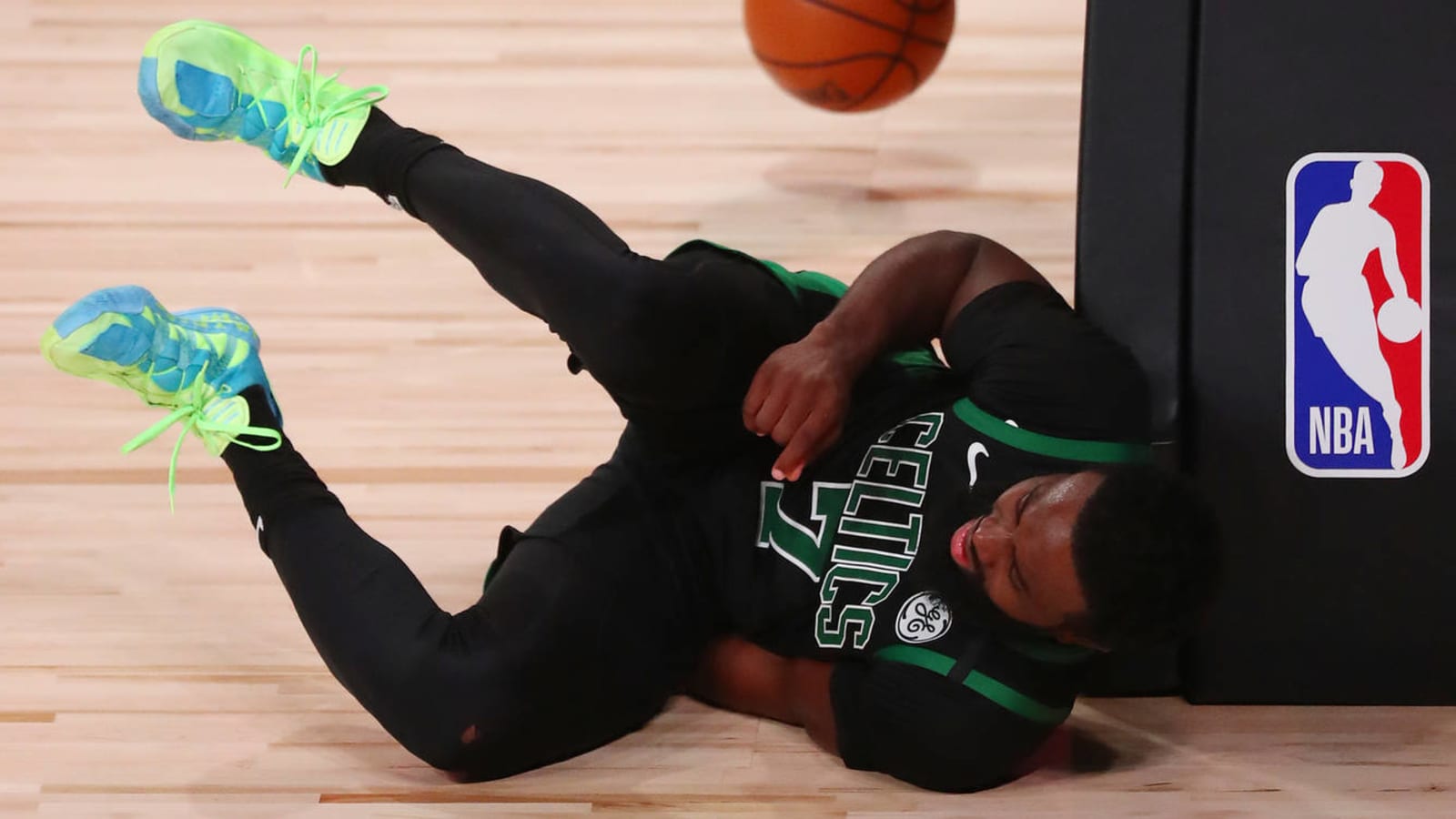 Watch: Jaylen Brown slips after a dunk, remains in game