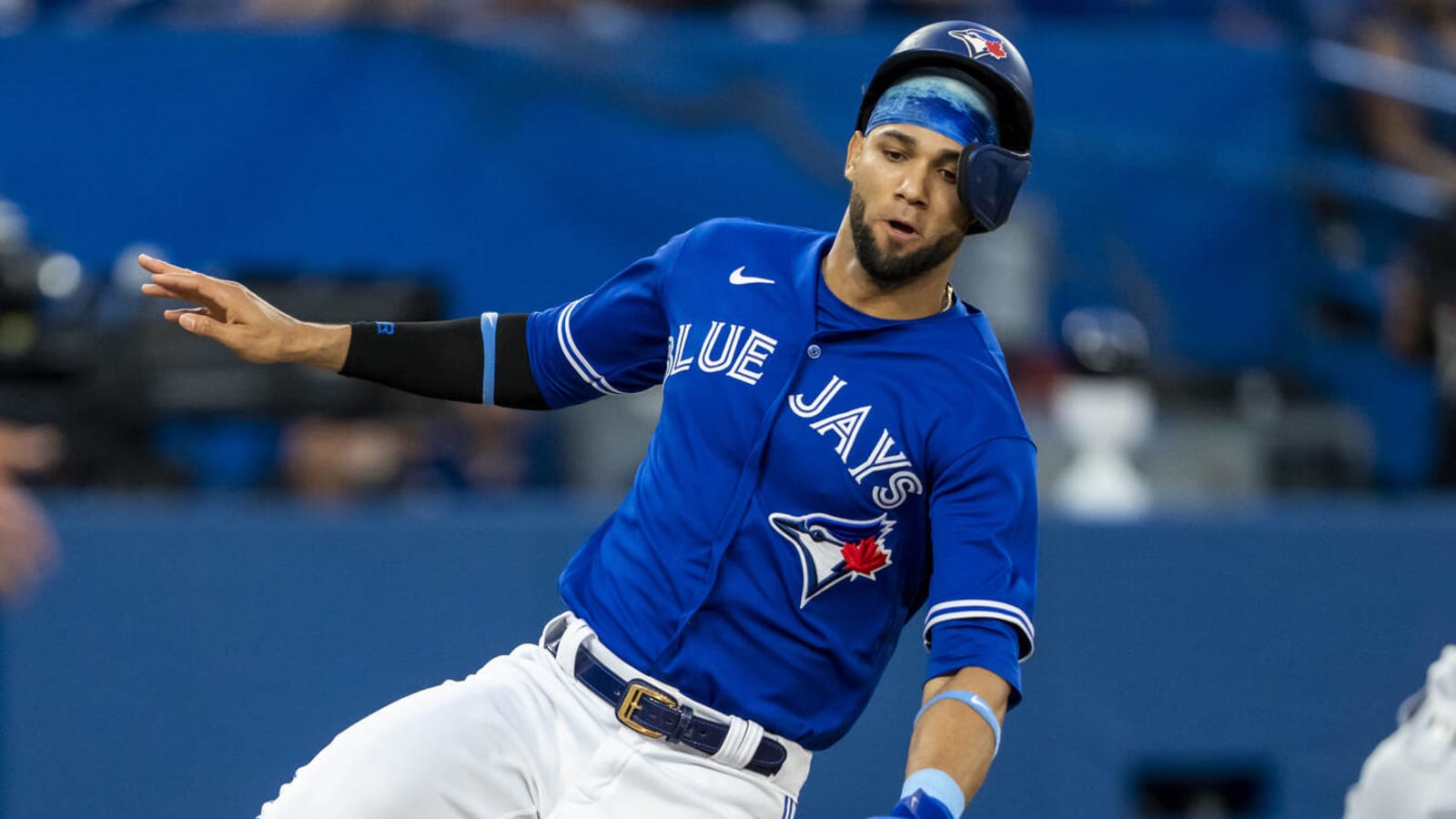 TORONTO, ON - MAY 9: Lourdes Gurriel Jr. #13 of the Toronto Blue Jays looks  on from the top step of the dugout d…