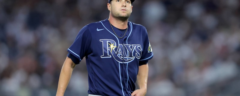 Tampa Bay Rays pitching coach Kyle Snyder, left, looks on as Shane  McClanahan holds his all-star jersey before a baseball game against the  Baltimore Orioles Saturday, July 16, 2022, in St. Petersburg