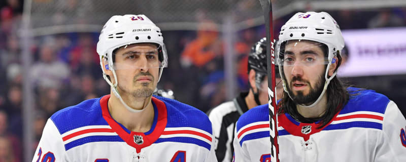 Hall of Fame hockey forward Rod Gilbert, left, and New York Mets