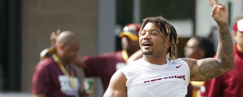 Washington players not violating protocol by being at team facilities 