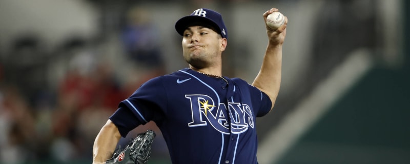 Tampa Bay Rays pitching coach Kyle Snyder, left, looks on as Shane