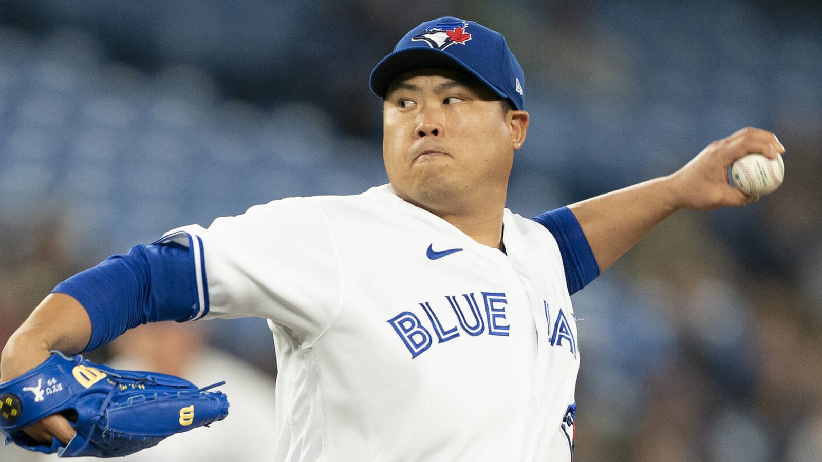 Toronto Blue Jays newly signed pitcher Hyun-Jin Ryu, right, holds