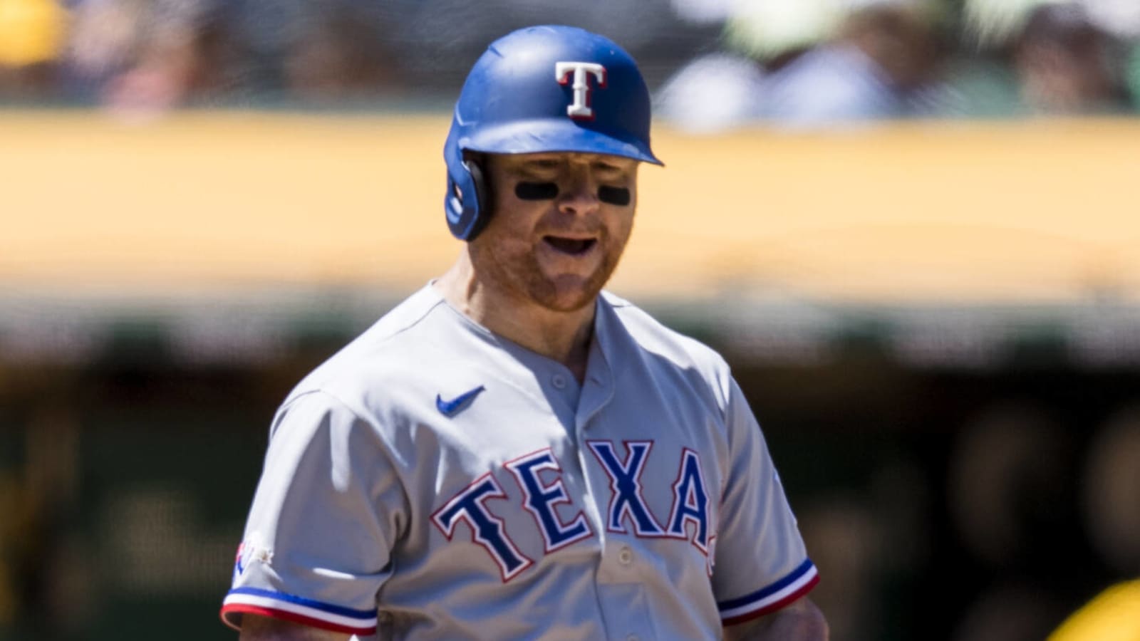 Kole Calhoun of the Texas Rangers runs the bases after hitting a