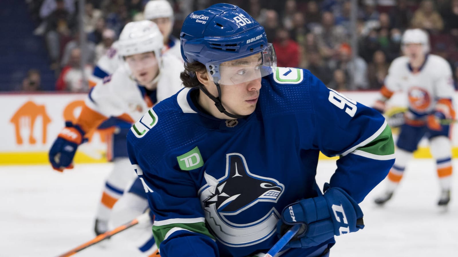 Why did the Canucks sign, rather than trade, Andrei Kuzmenko?