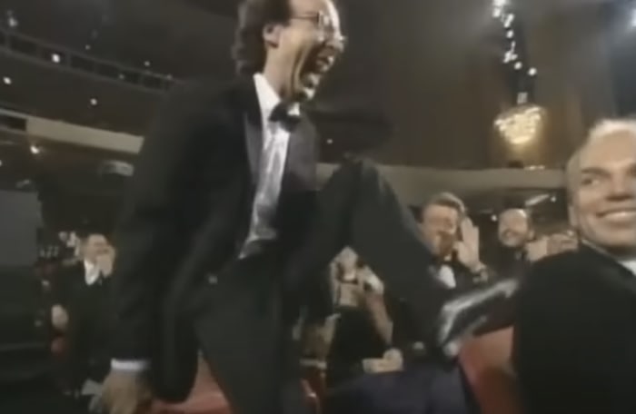 Roberto Benigni walking on seats