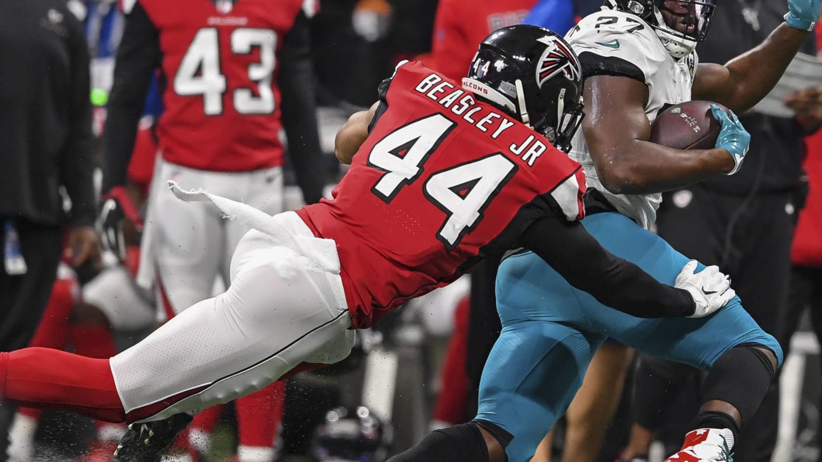 Despite 'unexcused' absence, Titans GM expects Vic Beasley to report to team